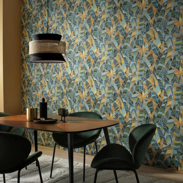 Erismann Elle Decoration 4 green botanical wallpaper with layered leaf pattern and textured finish set in a mid-century modern dining room 