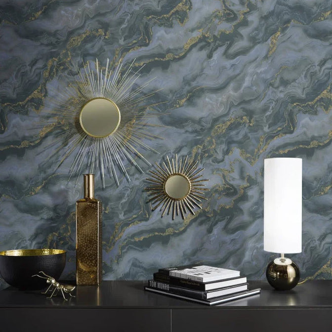 Erismann Elle Decoration 4 abstract wallpaper with grey and blue marble effect and gold accents against mirrors and table lamp 
