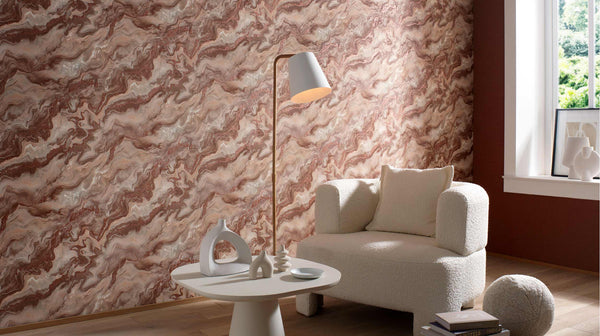 Erismann Elle Decoration 4 marble effect wallpaper in warm terracotta tones styled in a modern living room with neutral furniture