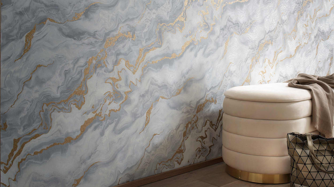 Erismann Elle Decoration 4 marble wallpaper in soft white and light grey tones with gold accents and fluid abstract pattern