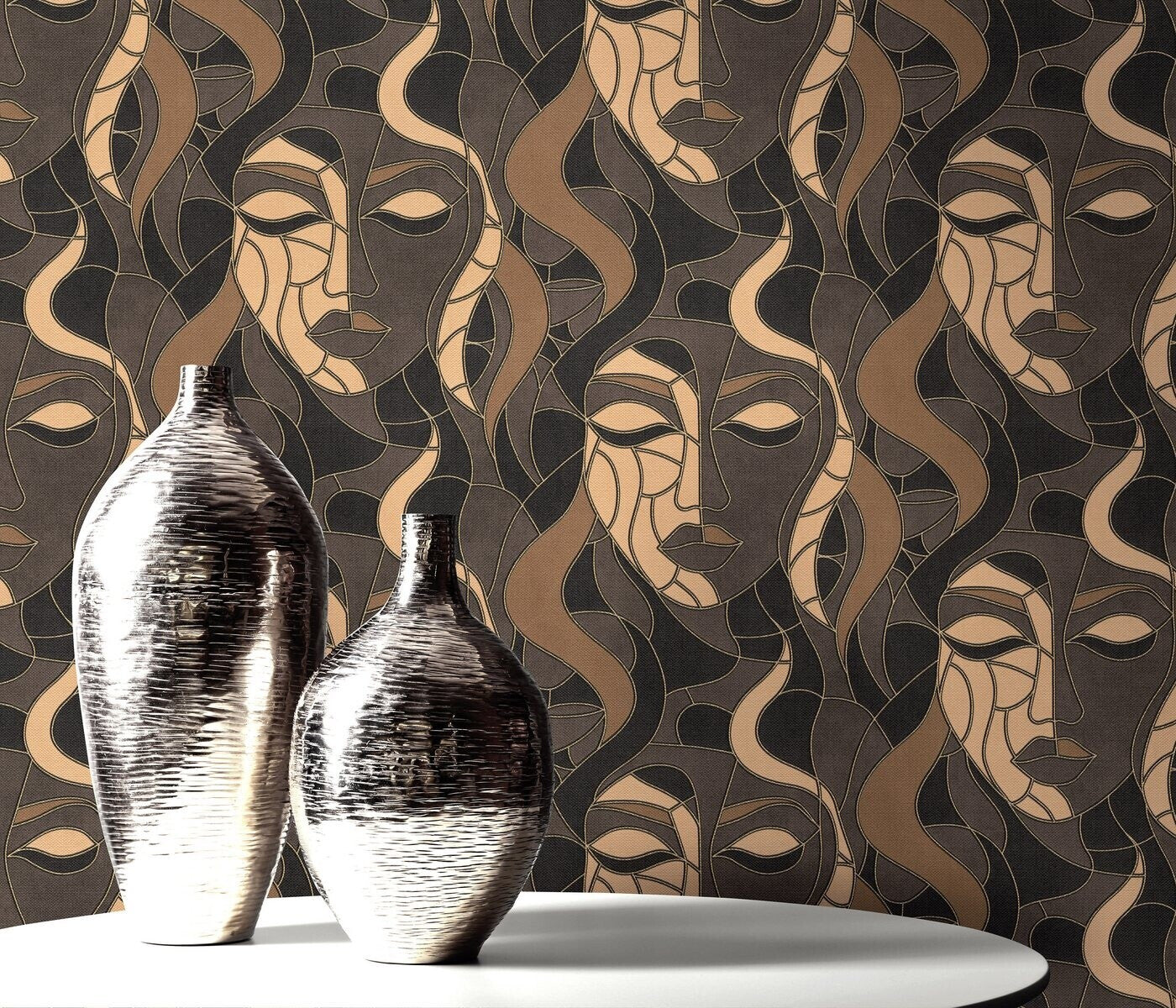 Erismann Elle Decoration abstract face wallpaper in brown and gold tones styled behind a round table and silver vases