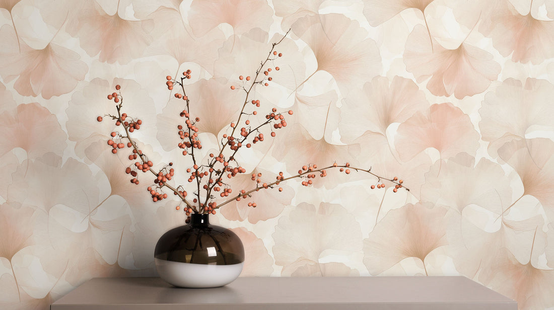 Erismann Elysium botanical wallpaper featuring subtle ginkgo leaf silhouettes in soft beige and white tones, creating a light, minimal and elegant backdrop.