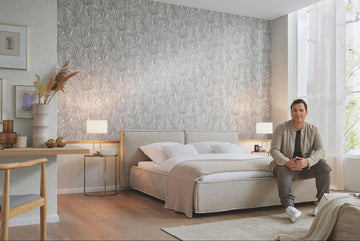 Erismann Fashion For Walls 4 10371-31 wallpaper bedroom feature wall behind upholstered bed, twin bedside lamps, framed art and desk nook, large window with sheer curtains, calm airy mood.