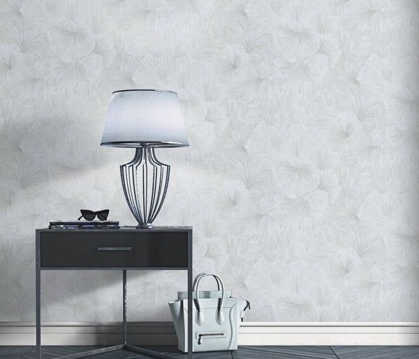 Erismann Fashion For Walls 4 10373-31 wallpaper lounge feature wall behind a modern side table with metal lamp and sunglasses, handbag on floor, minimalist calm look.