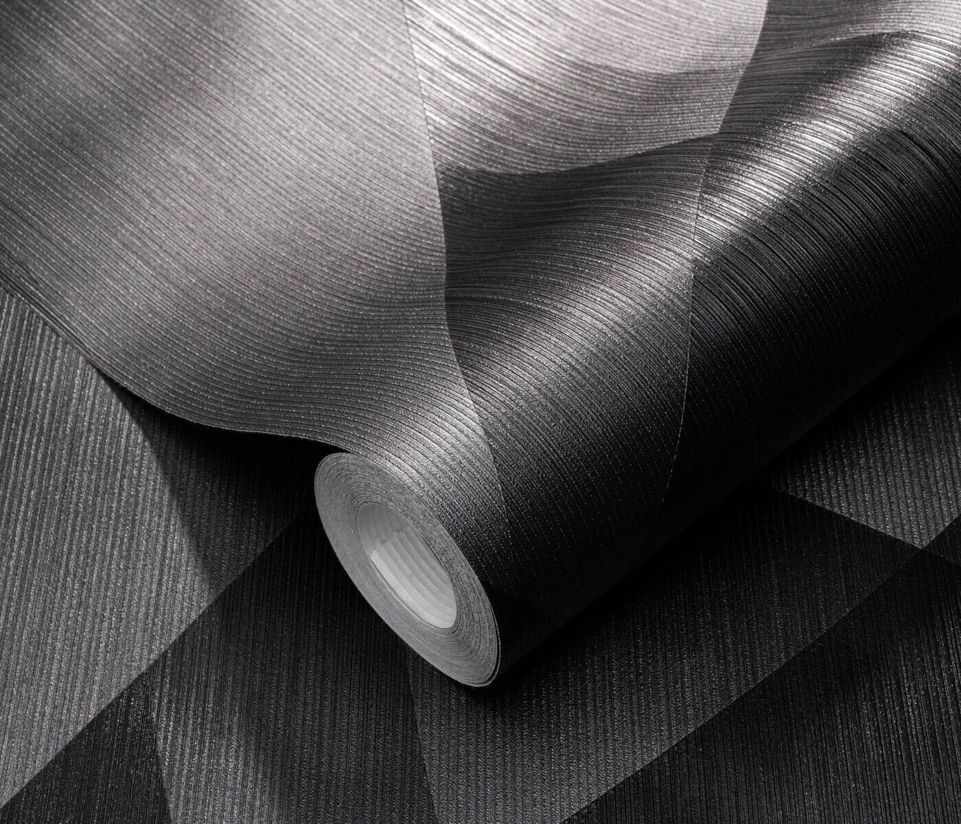 Erismann Fashion For Walls 4 10374-15 wallpaper close-up roll showing dark shimmering ribbed geometric texture, moody modern look.