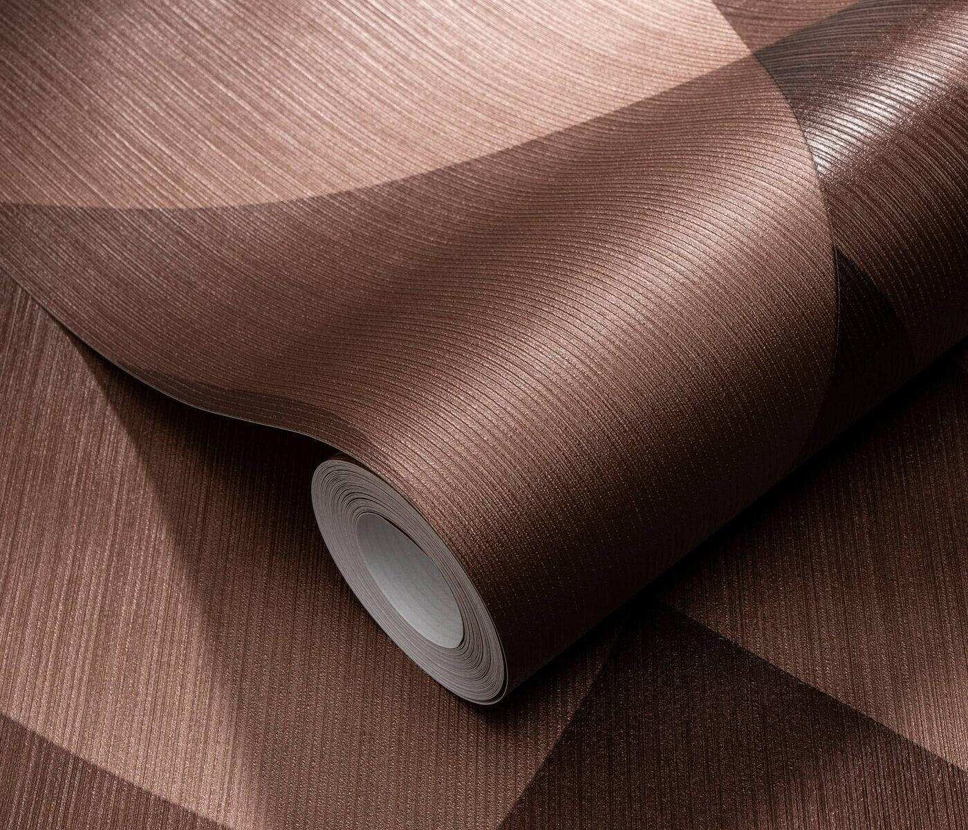 Erismann Fashion For Walls 4 10374-48 wallpaper close-up of a rolled sheet with ribbed geometric pattern in deep brown.