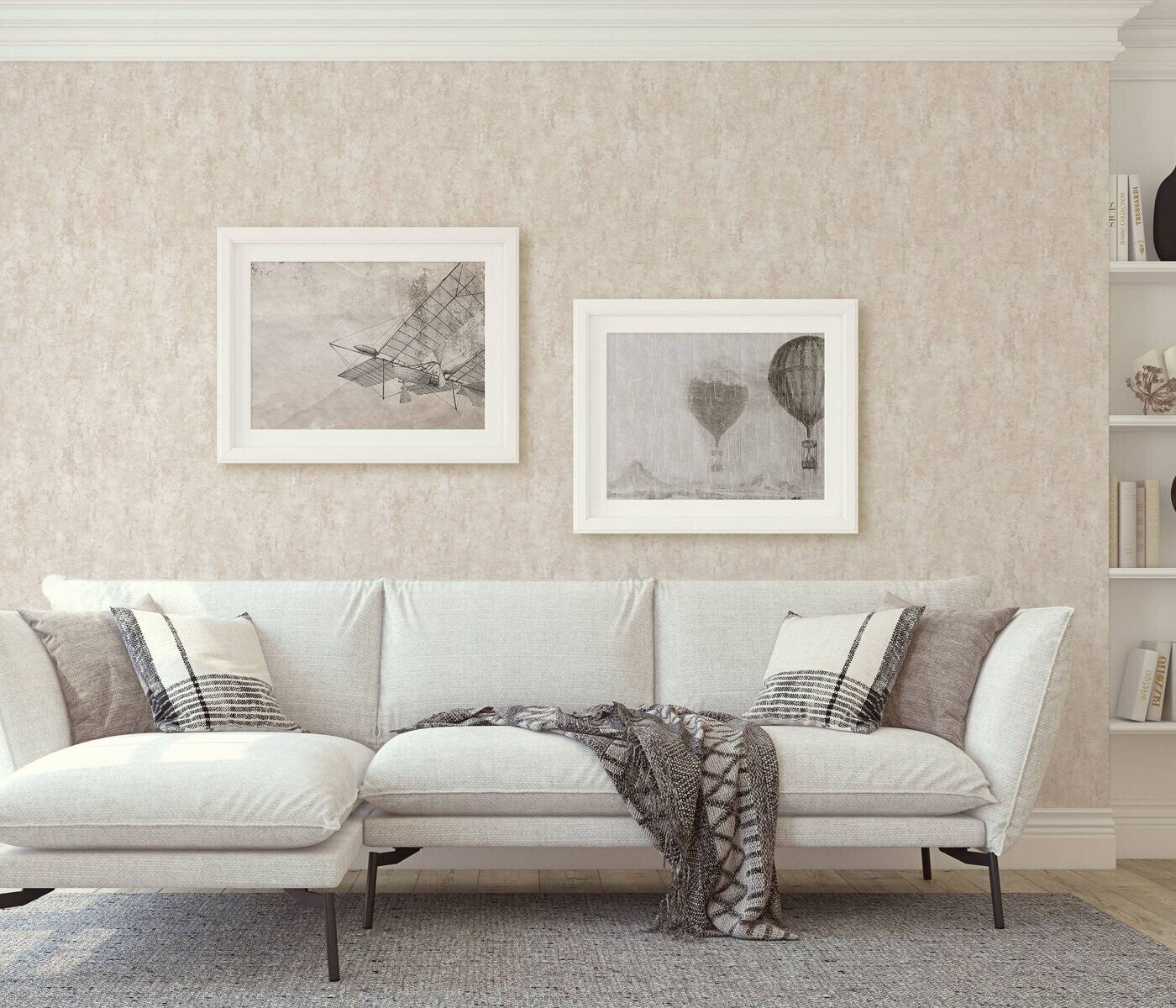 Erismann Fashion For Walls 4 10375-02 wallpaper lounge feature wall behind a light sofa with cushions and throw, two framed prints, built-in shelves, and a calm cozy mood.