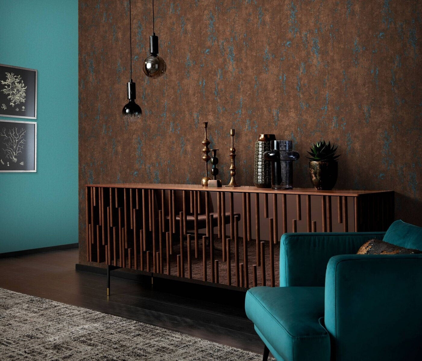 Erismann Fashion For Walls 4 10375-19 wallpaper lounge feature wall with textured brown finish, wooden sideboard styled with vases and candlesticks, teal armchair, and pendant lights for a moody modern look.