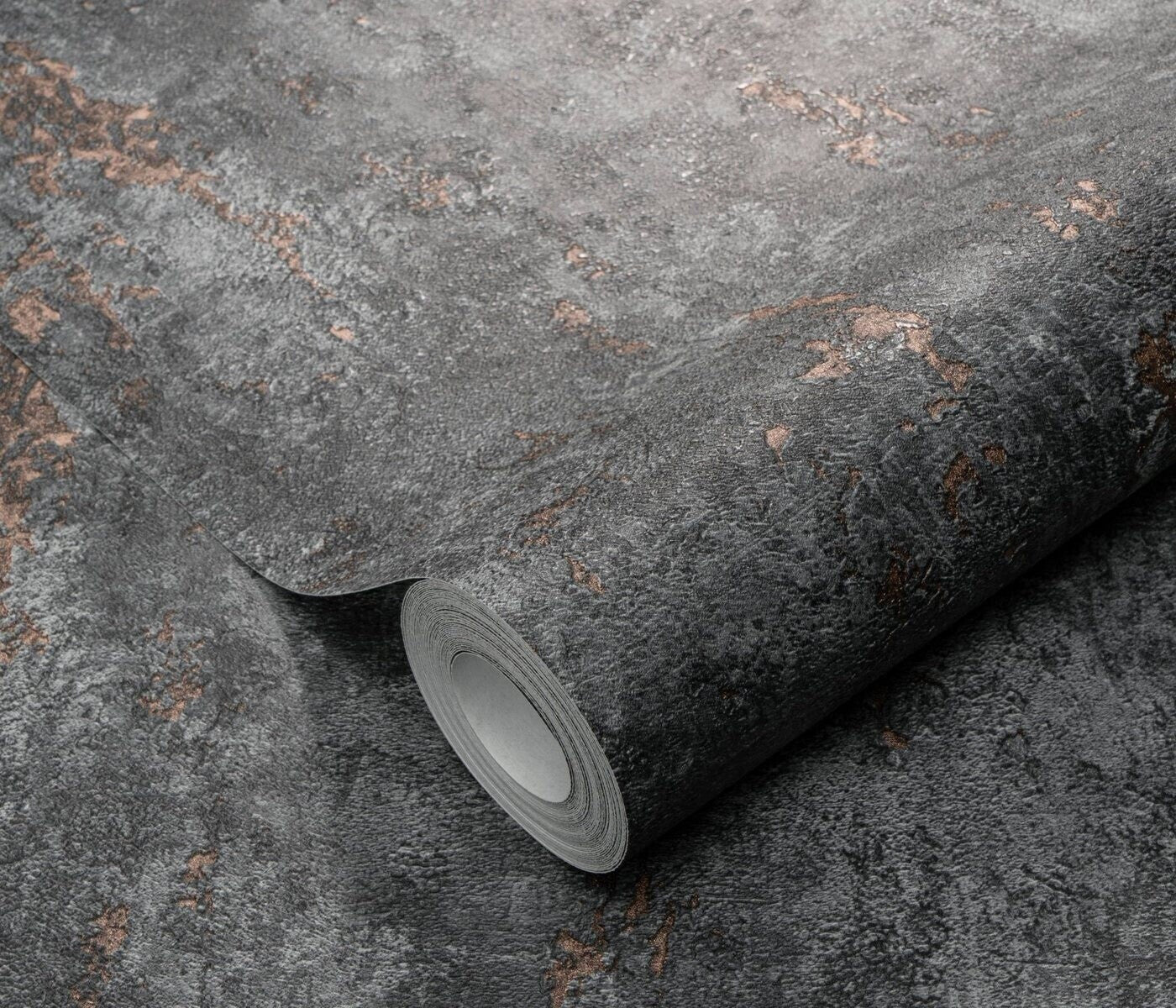 Erismann Fashion For Walls 4 10375-47 wallpaper roll close-up with rugged charcoal stone-effect texture and subtle brown flecks.