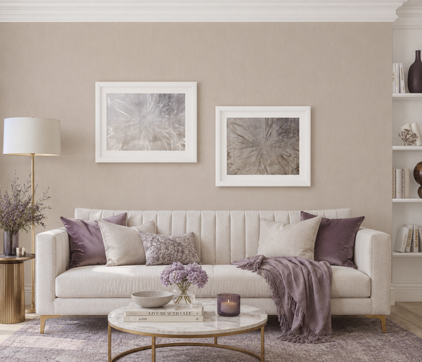 Erismann Fashion For Walls 4 10376-02 wallpaper lounge feature wall behind a cream sofa with two framed artworks, purple cushions and throw, marble coffee table, floor lamp and styled shelves.