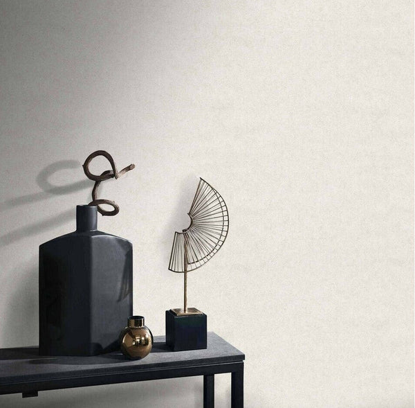 Erismann Fashion For Walls 4 10377-26 wallpaper in a lounge feature wall behind a slim console table with a black vase, small metallic vase, and metal wire sculpture, minimalist and calm.