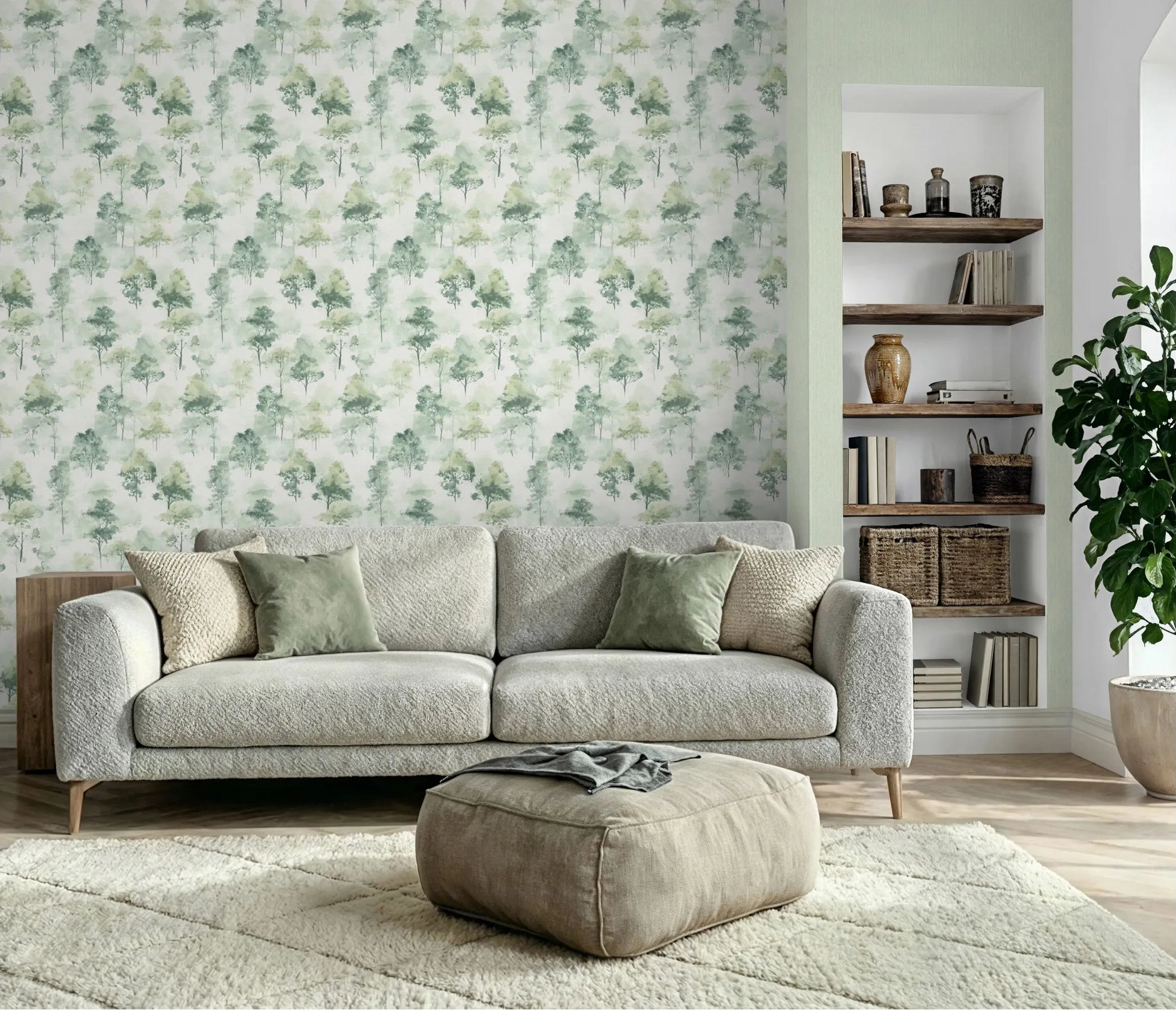 Erismann Forest Dreams 10557-07 wallpaper tree motif feature wall behind a sofa with shelving nook, ottoman, rug, and potted plant.