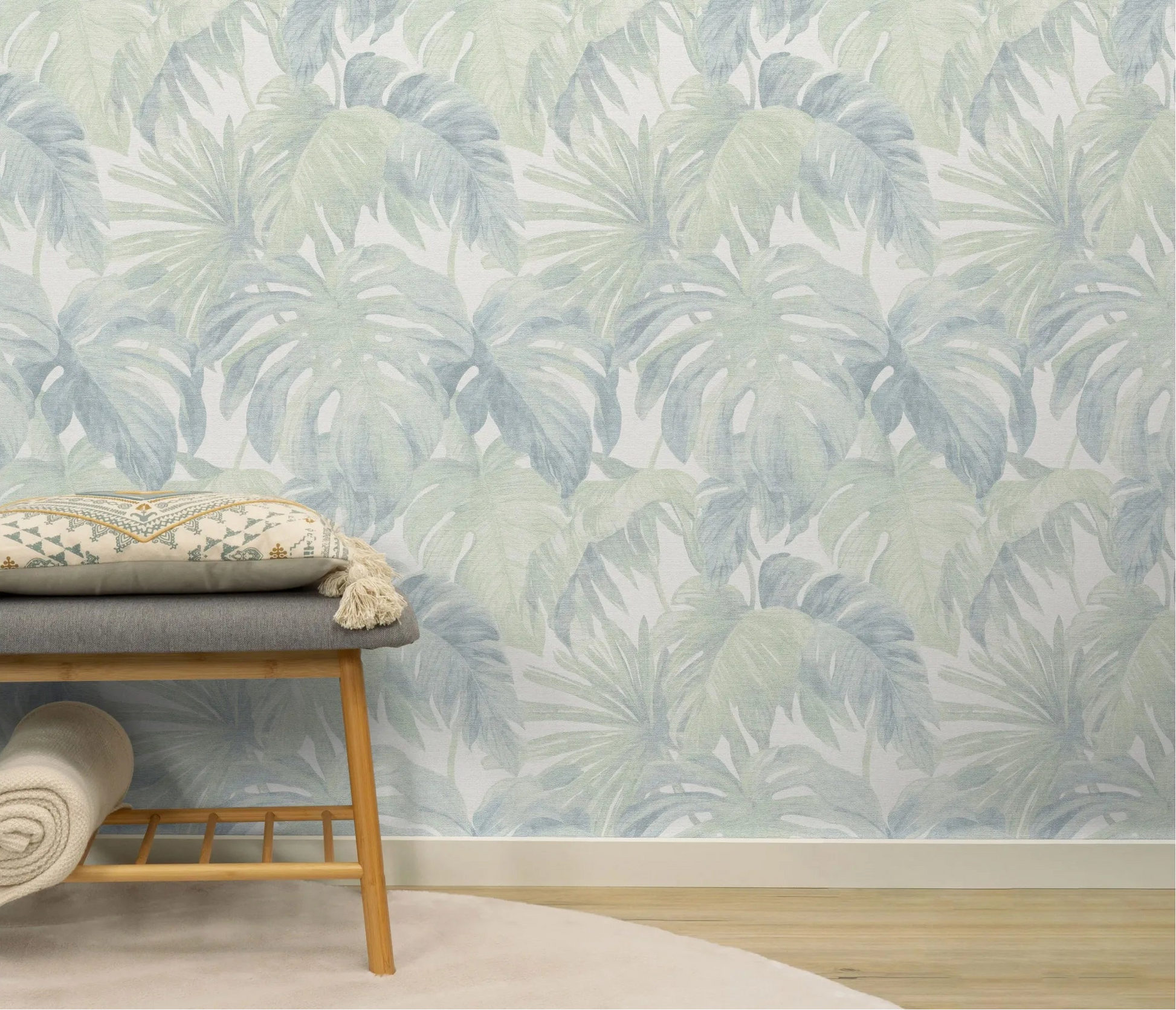 Erismann Forest Dreams 10558-07 wallpaper on the wall behind a wooden bench with patterned cushion and rolled throw.