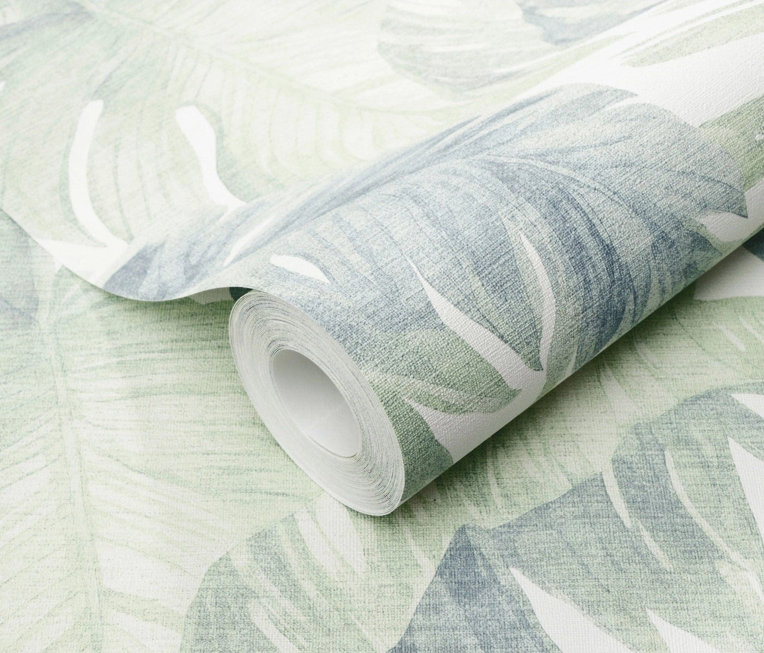 Erismann Forest Dreams 10558-07 wallpaper roll close-up with pale green and blue leafy print on woven texture.