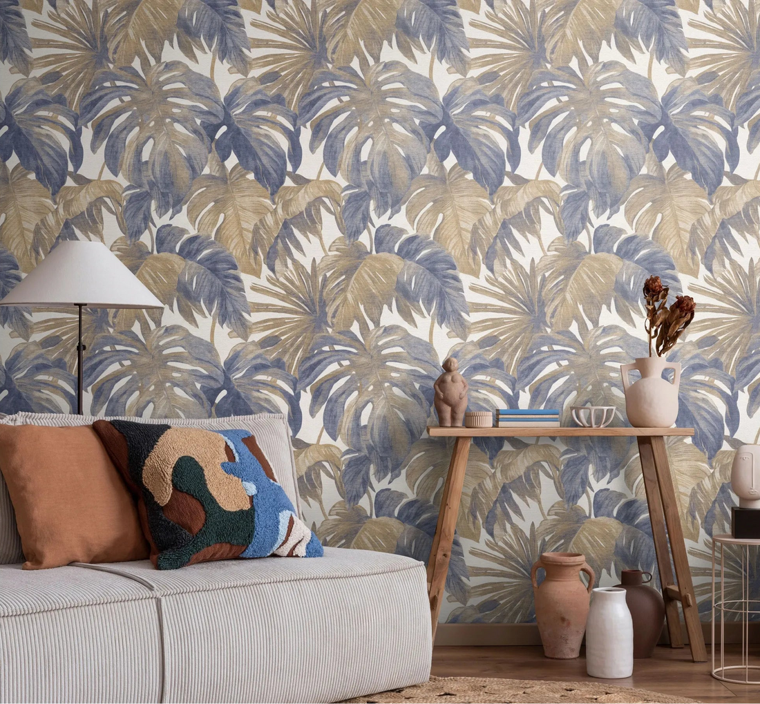 Erismann Forest Dreams 10558-44 wallpaper on a living room wall behind a sofa, cushions, floor lamp, and console table.