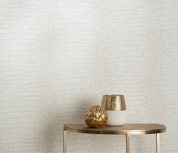 Erismann Forest Dreams 10560-02 wallpaper behind a gold side table with a two-tone vase and metallic decorative sphere.