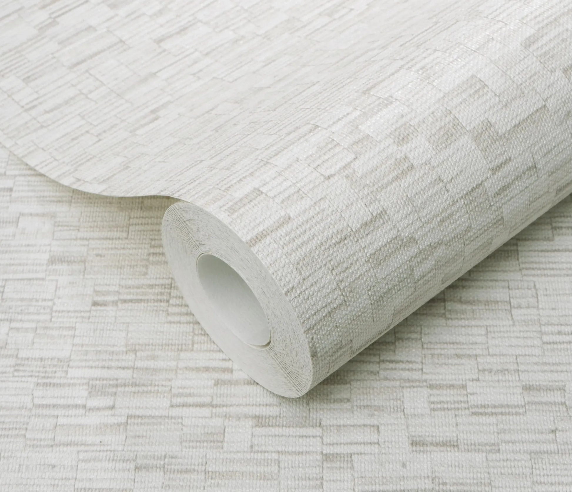 Erismann Forest Dreams 10562-38 wallpaper roll close-up with raised woven texture and subtle rectangular line pattern.