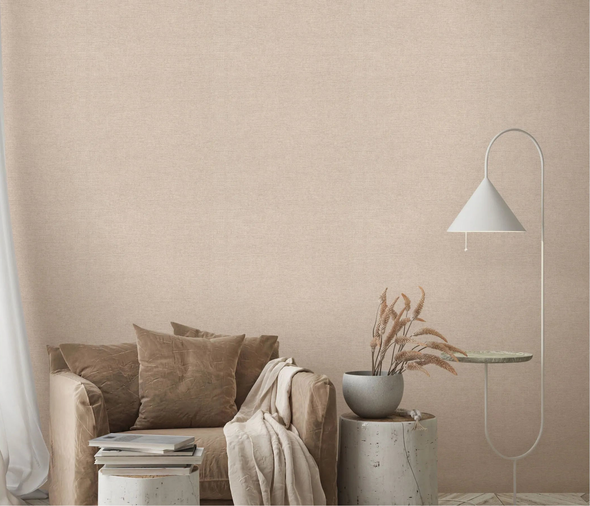 Erismann Forest Dreams 10563-02 wallpaper on a textured beige living room wall behind an armchair with cushions, books, vase, and floor lamp.