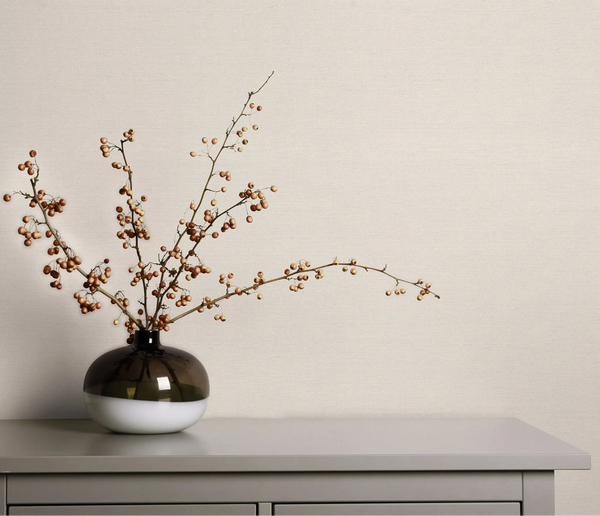 Erismann Forest Dreams 10563-26 wallpaper on the wall behind a chest of drawers with a vase of berry branches.
