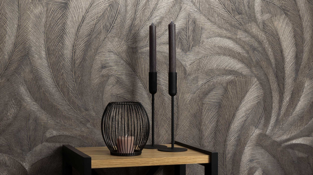 Erismann Elysium botanical wallpaper featuring layered feather-like leaves in deep brown, soft gray and warm beige tones, enhanced by fine linear detailing and subtle metallic accents for a rich and textured appearance.