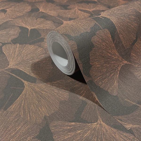 Marburg Boho 35779 Close-up product photo of a wallpaper roll resting on matching wallpaper with a fine-lined ginkgo leaf motif.