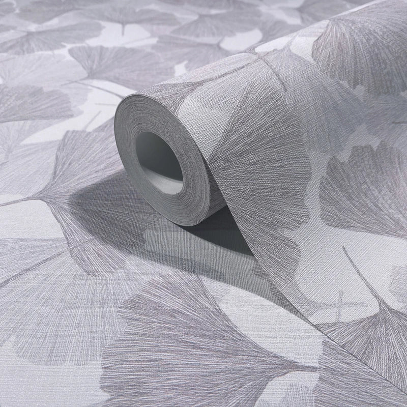 Marburg Boho 35783 Wallpaper roll on a matching surface showing a gray fan-shaped leaf design with fine line texture.