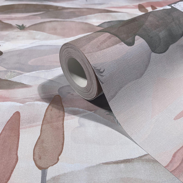 Marburg Boho 35786 Wallpaper roll resting on matching textured paper with a soft, painterly abstract pattern in pink, taupe, and gray hues.