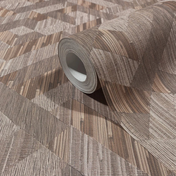 Marburg Boho 35789 Roll of brown wallpaper with a geometric woodgrain pattern, partially unrolled on matching wallpaper.