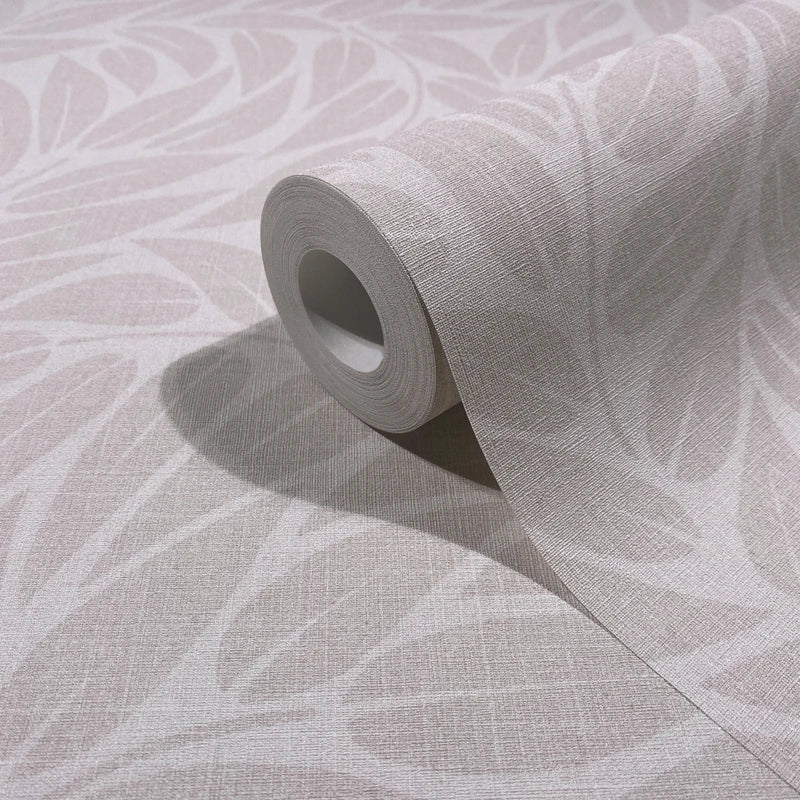 Marburg Boho 35794 Close-up of a wallpaper roll resting on matching unrolled sheet, showing a tonal leaf pattern with a subtle linen texture in light grey shades.