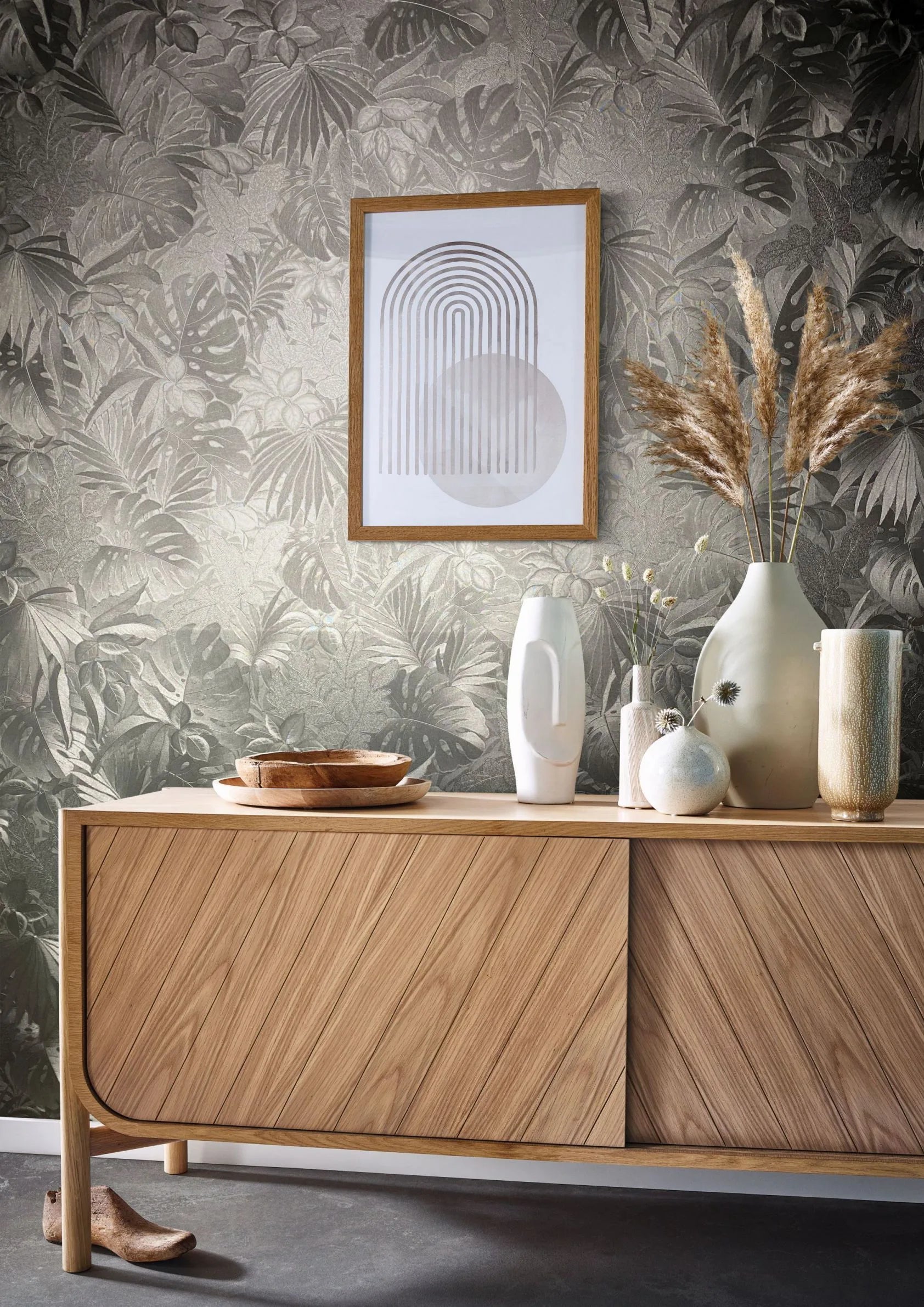 Marburg Botanica 33302 Tonal gray tropical foliage wallpaper with layered leaves and a subtle sheen and texture wallpaper shown in a styled detail.
