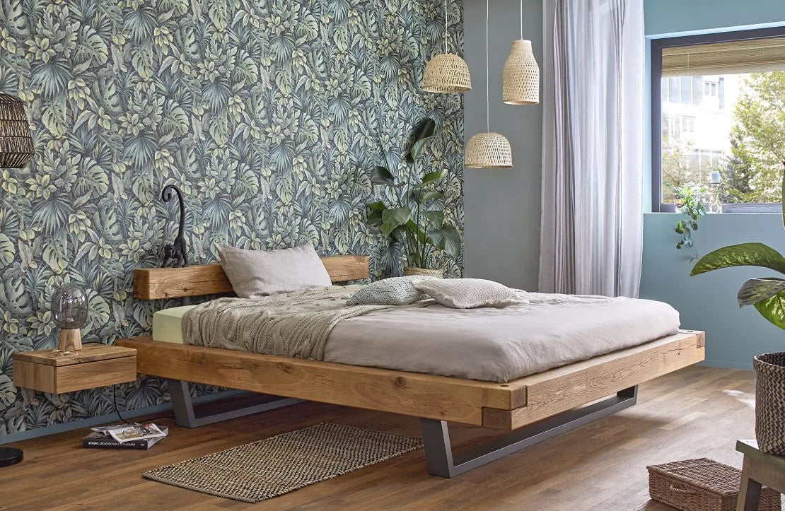 Marburg Botanica 33304 Dense tropical foliage motif with layered green leaves on a darker ground; medium to large scale wallpaper on a bedroom feature wall.