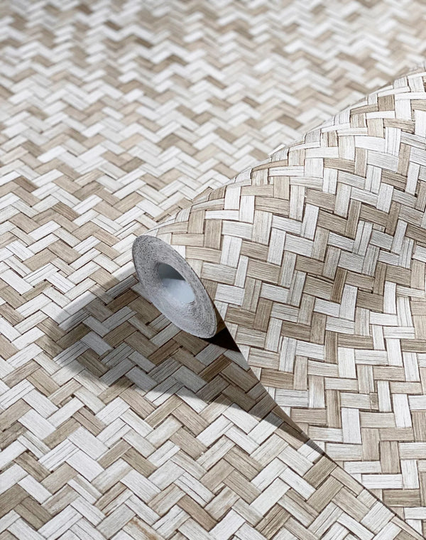 Marburg Botanica 33309 Close-up of a wallpaper roll resting on matching wallpaper showing a beige and white herringbone basket-weave pattern.