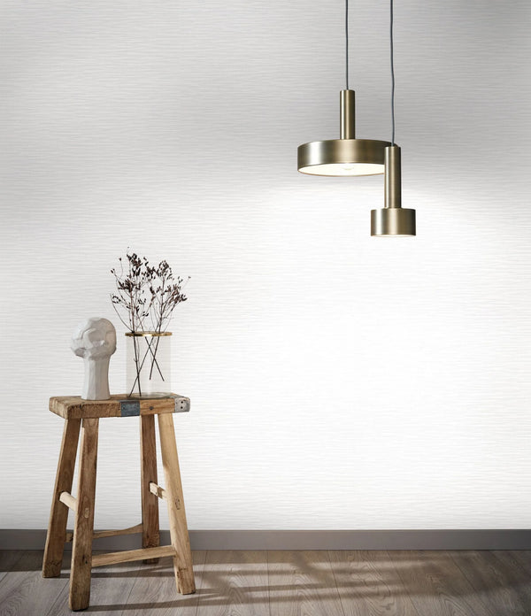 Marburg Botanica 33322 Light gray-white wallpaper with fine horizontal striations creating a subtle textured look wallpaper on a styled interior feature wall.
