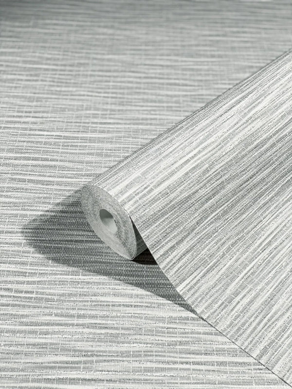Marburg Botanica 33323 A gray textured wallpaper roll with fine horizontal striations resting on the same patterned sheet.
