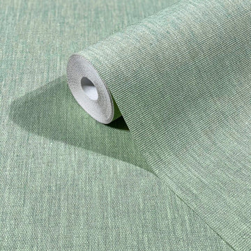 Marburg Botanica 33331 A green textured wallpaper roll partially unrolled on a matching surface, showing a fine woven-look pattern.