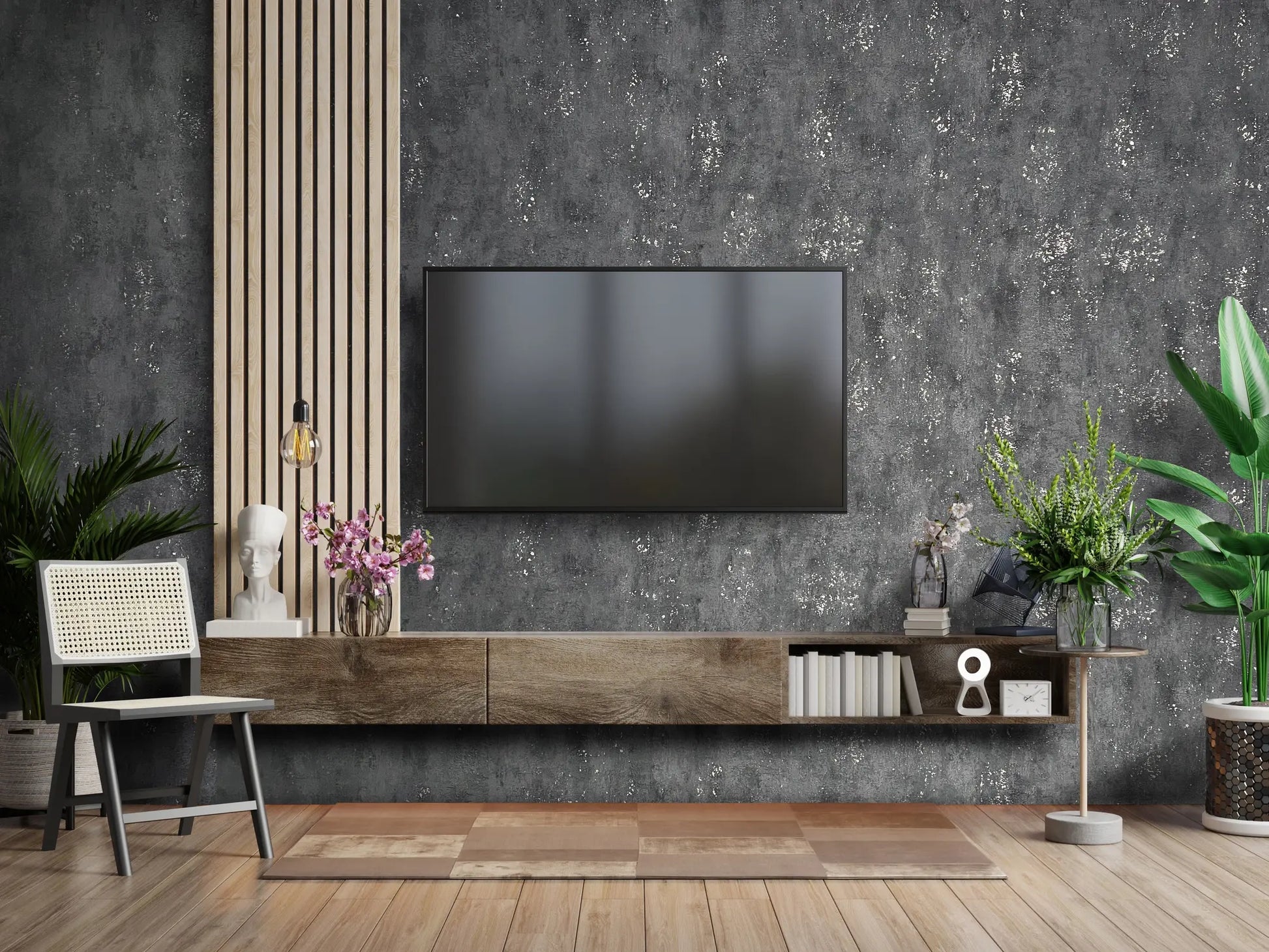 Marburg City Glam 32638 Charcoal gray wallpaper with a mottled, concrete-like texture and irregular light speckles wallpaper on a living room feature wall.