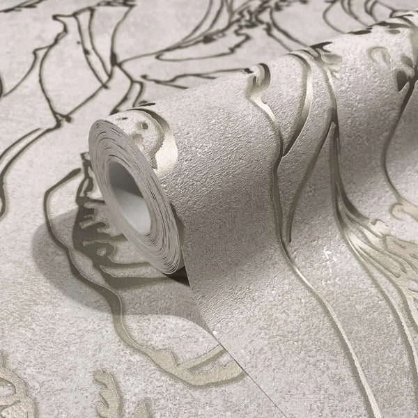 Marburg City Glow 34252 Close-up of a wallpaper roll resting on matching unrolled wallpaper, showing a light neutral textured surface with large flowing embossed outlines.