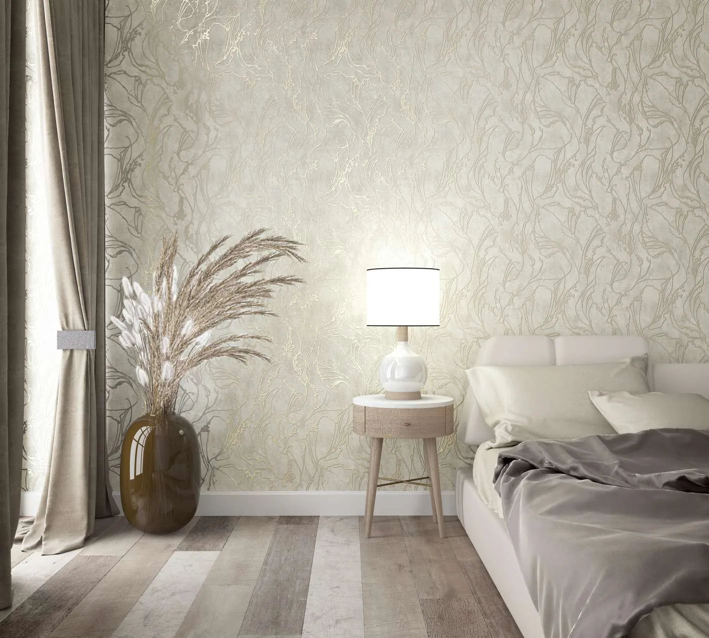 Marburg City Glow 34252 Bedroom scene showing light beige wallpaper with a flowing botanical pattern behind a bedside table with a white lamp, an upholstered bed with bedding, curtains, and a large vase holding pampas grass.