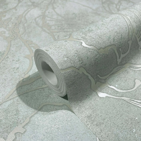 Marburg City Glow 34253 Close-up of a wallpaper roll on a matching sheet showing an abstract branching line pattern on a mottled gray background with a slight sheen.