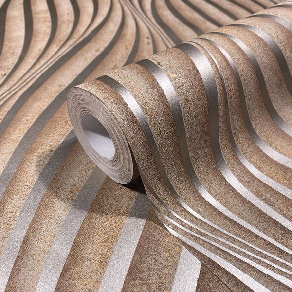 Marburg City Glow 34262 Close-up of a wallpaper roll on matching surface showing undulating brown and light grey stripes with a textured, mottled look.