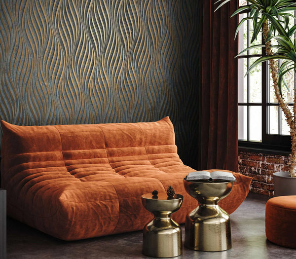 Marburg City Glow 34263 Black wallpaper with metallic copper wavy lines on a feature wall behind a rust-colored sofa, two brass side tables with a book, a tall potted plant, window with curtains, and an ottoman.