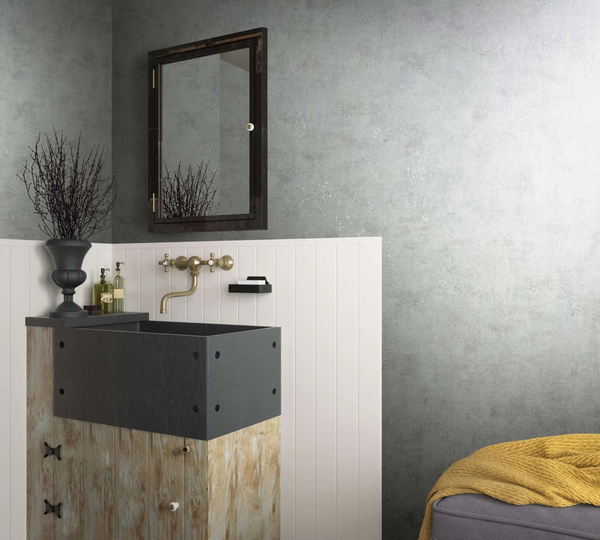 Marburg City Glow 34281 Bathroom scene showing gray mottled wallpaper above white vertical paneling, a vanity with a dark basin, wall-mounted mirror and faucet, small wall shelf with soap, bottles, a decorative urn with branches, and a gray ottoman with a yellow throw.