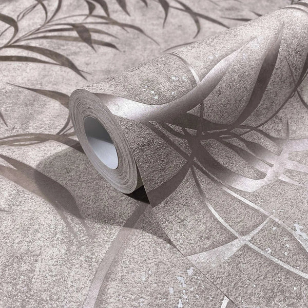 Marburg City Glow 34285 Close-up of a wallpaper roll resting on matching wallpaper, showing abstract curved metallic lines on a textured neutral background.