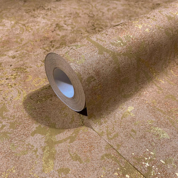 Marburg City Glow 34295 A brown wallpaper roll with metallic gold distressed scrolls, shown partially unrolled on a matching surface.
