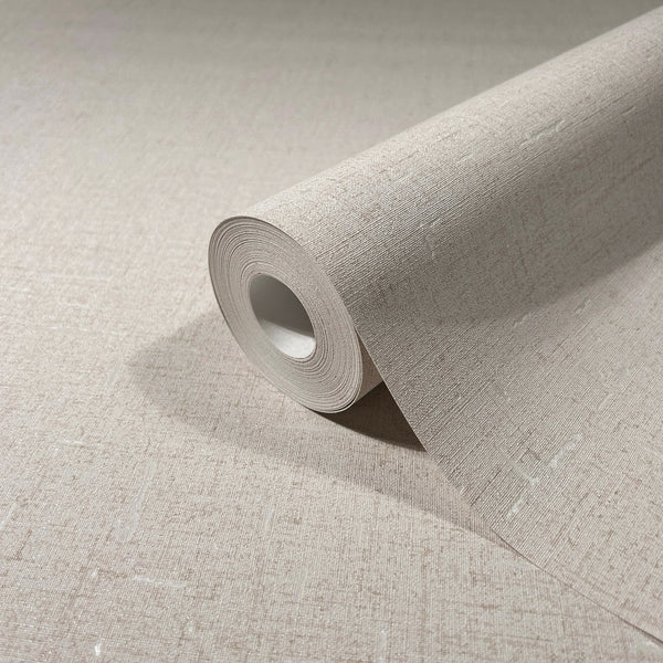 Marburg City Romance 35107 A beige textured wallpaper roll partially unrolled on a matching surface, showing a fine linen-like crosshatch pattern with small irregular slubs.