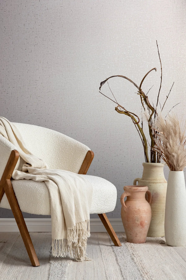 Marburg City Romance 35110 Light gray textured wallpaper with a subtle irregular short-line pattern, resembling a fine woven or wallpaper on a living room feature wall.