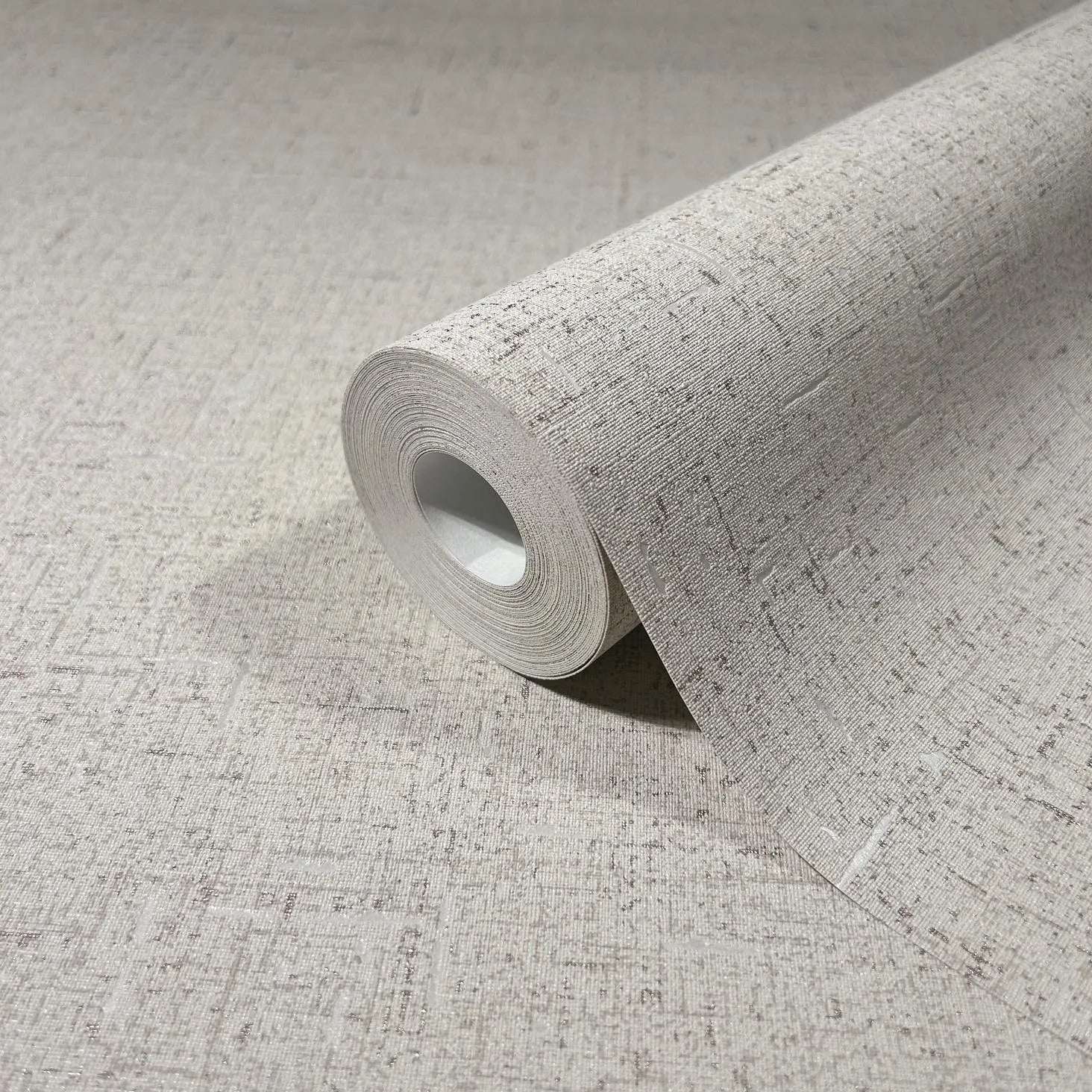 Marburg City Romance 35113 Wallpaper roll with a beige-gray crosshatch texture, partially unrolled across the same pattern.