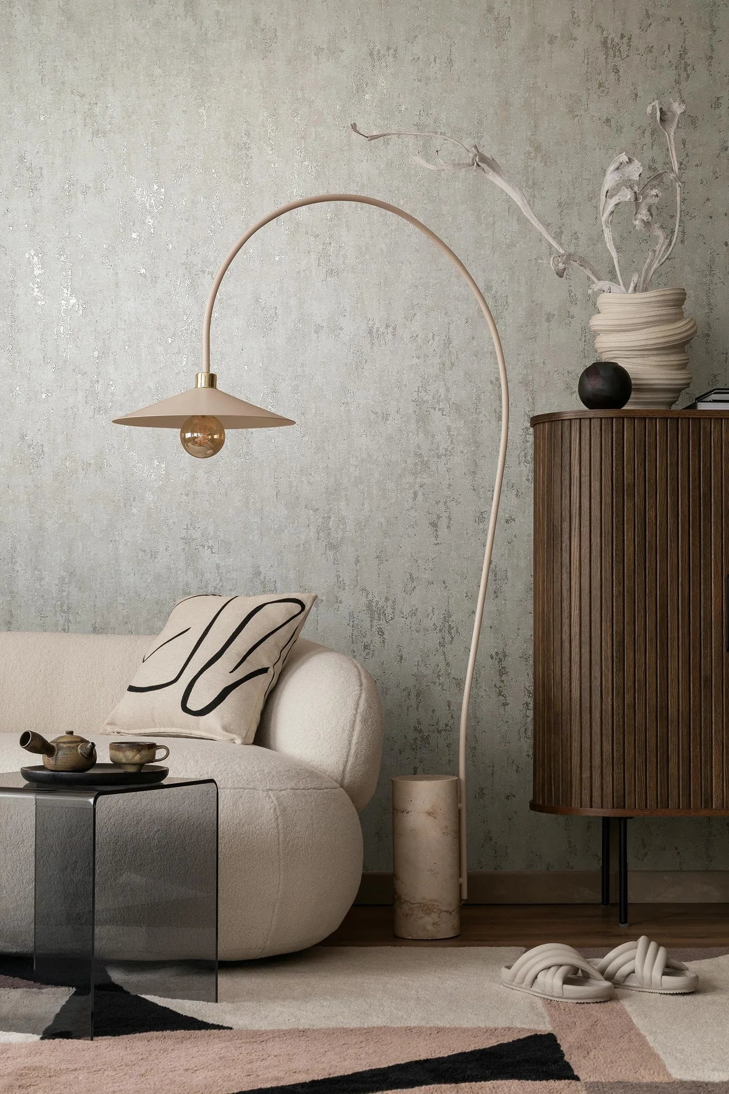 Marburg City Romance 35123 Mottled gray wallpaper with a distressed, textured look and subtle metallic flecks wallpaper on a living room feature wall.