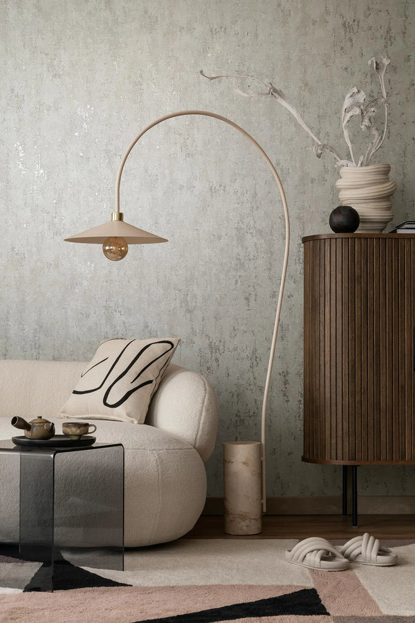 Marburg City Romance 35123 Mottled gray wallpaper with a distressed, textured look and subtle metallic flecks wallpaper on a living room feature wall.