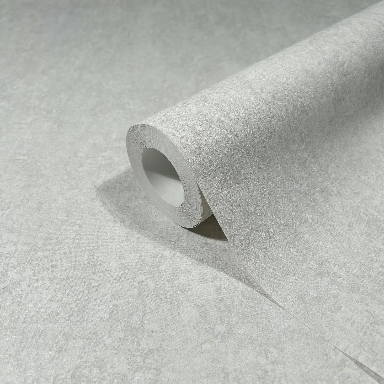 Marburg 35136 wallpaper close-up of light gray textured roll with subtle mottled pattern.